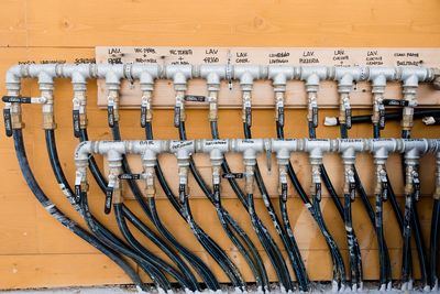 Cables against wooden wall