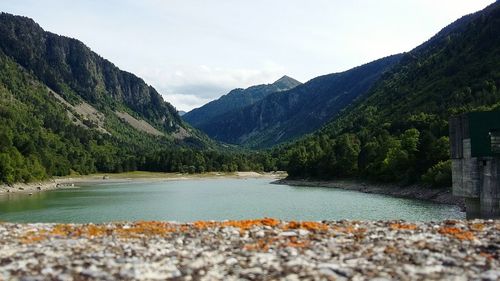 Scenic view of lake and mountains against sky