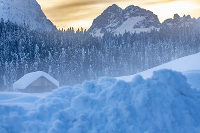 Scenic view of snow covered mountains against sky