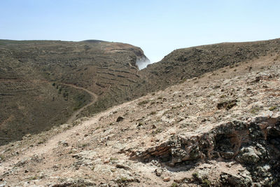 Scenic view of rocky mountains against clear sky