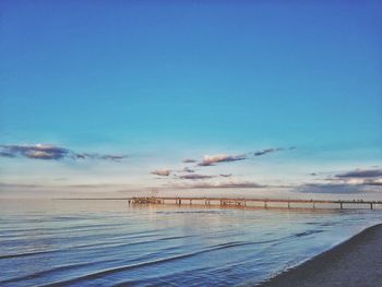 Scenic view of sea against blue sky