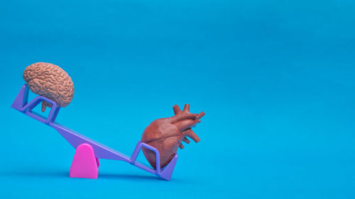 Digital composite image of hand against blue background