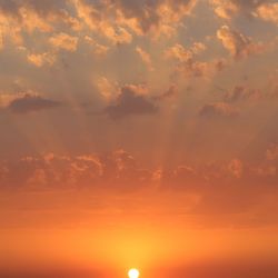 Low angle view of dramatic sky during sunset