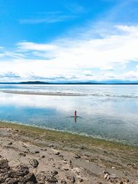 Scenic view of sea against blue sky