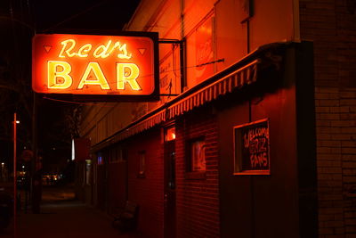 Illuminated information sign at night