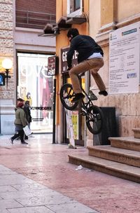 Man on bicycle in city