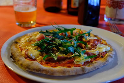 High angle view of pizza served on table