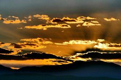 Scenic view of dramatic sky during sunset