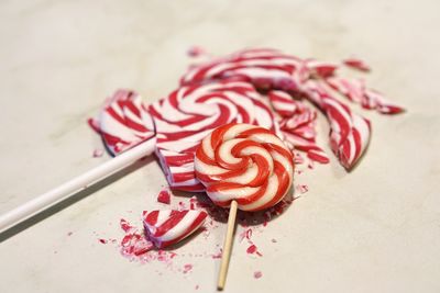 Close-up of lollipops on white table