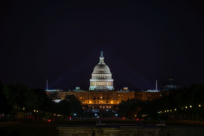 Illuminated buildings in city at night