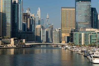 View of modern buildings in city against sky