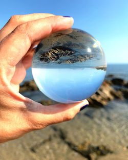 Close-up of human hand holding ball