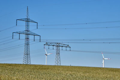 Power lines and wind turbines seen in rural germany