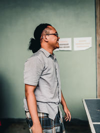 Side view of young man looking away