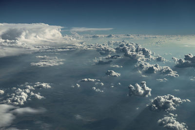 Aerial view of clouds over sea against sky