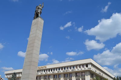 Low angle view of statue against cloudy sky