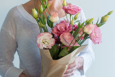 Close-up of pink roses holding bouquet