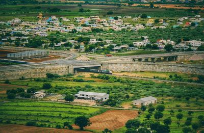High angle view of trees and buildings in city