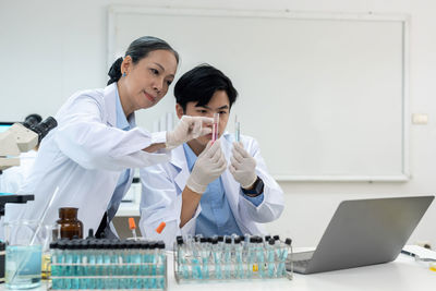 Side view of doctor working at laboratory