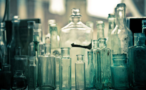 Close-up of various glass bottles on table