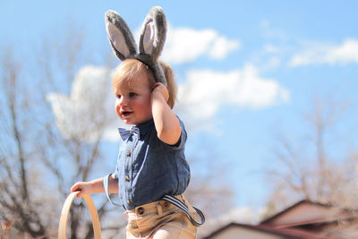 Easter bunny ears on small boy outside