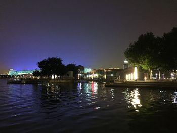 Reflection of illuminated buildings in water