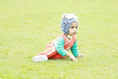 Cute boy playing on grass.
happyness