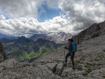 Women standing on mountain against sky