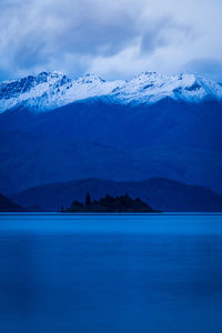 Scenic view of snowcapped mountains against sky during winter
