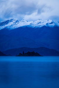 Scenic view of snowcapped mountains against sky during winter