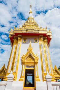 Low angle view of temple building against cloudy sky