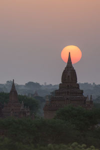 Historic temple against sky during sunset