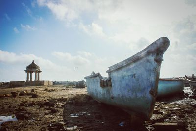 Old built structure against cloudy sky