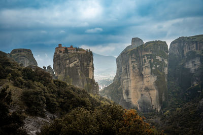 Rock formations on mountain against sky