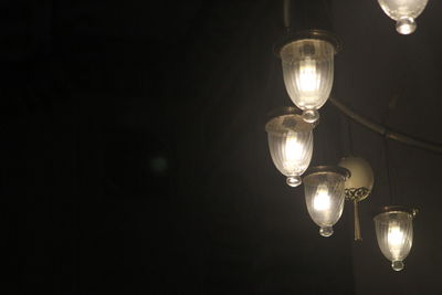 Low angle view of illuminated light bulb