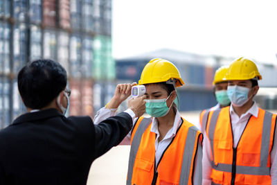 Rear view of people working