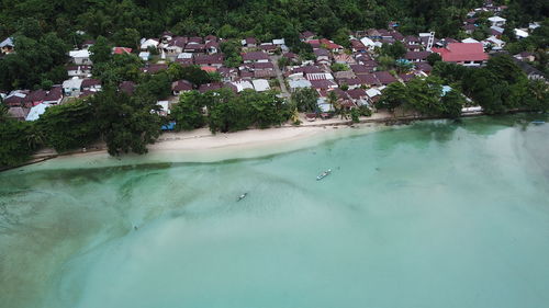 High angle view of houses by sea