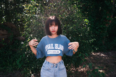 Portrait of teenage girl standing on land