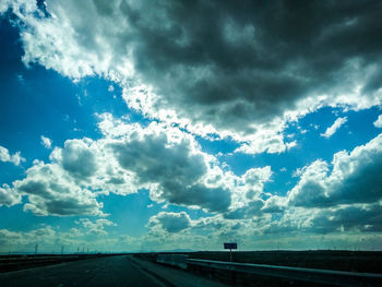 Road against cloudy sky