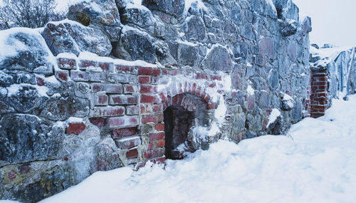 Castle ruins on snowy yard