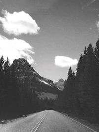 Country road leading towards mountains