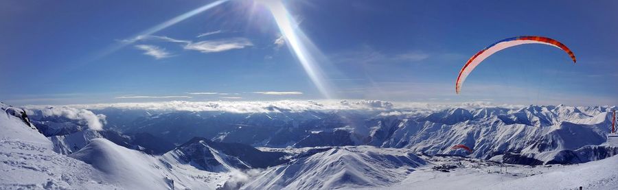 Scenic view of snowcapped mountains against sky