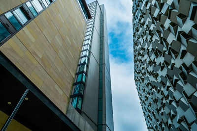 Low angle view of modern buildings against sky