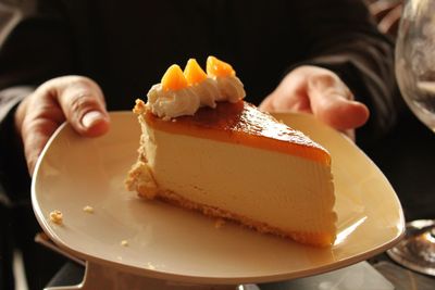 Close-up of hand holding ice cream