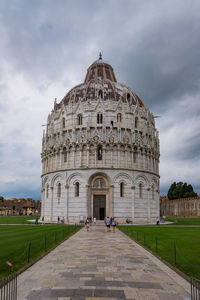 View of cathedral against cloudy sky - pisa, italy 