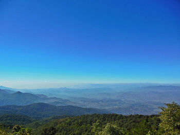 Scenic view of mountains against clear blue sky