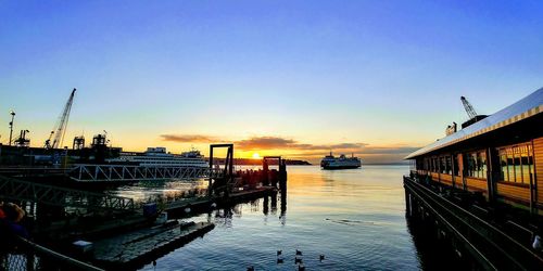 Boats moored at harbor