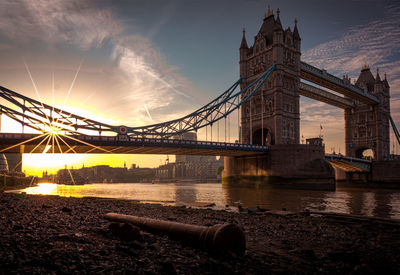 Suspension bridge over river at night