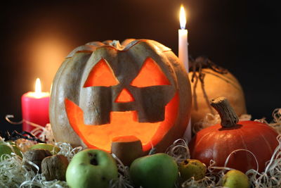 Close-up of pumpkins against illuminated lights