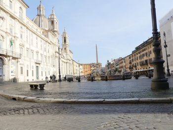 View of canal and buildings against sky